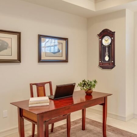 Dark brown solid oak wall clock